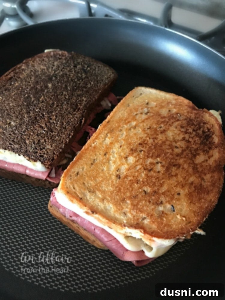 The Legendary Reuben 12 Grilling a Reuben sandwich on a skillet