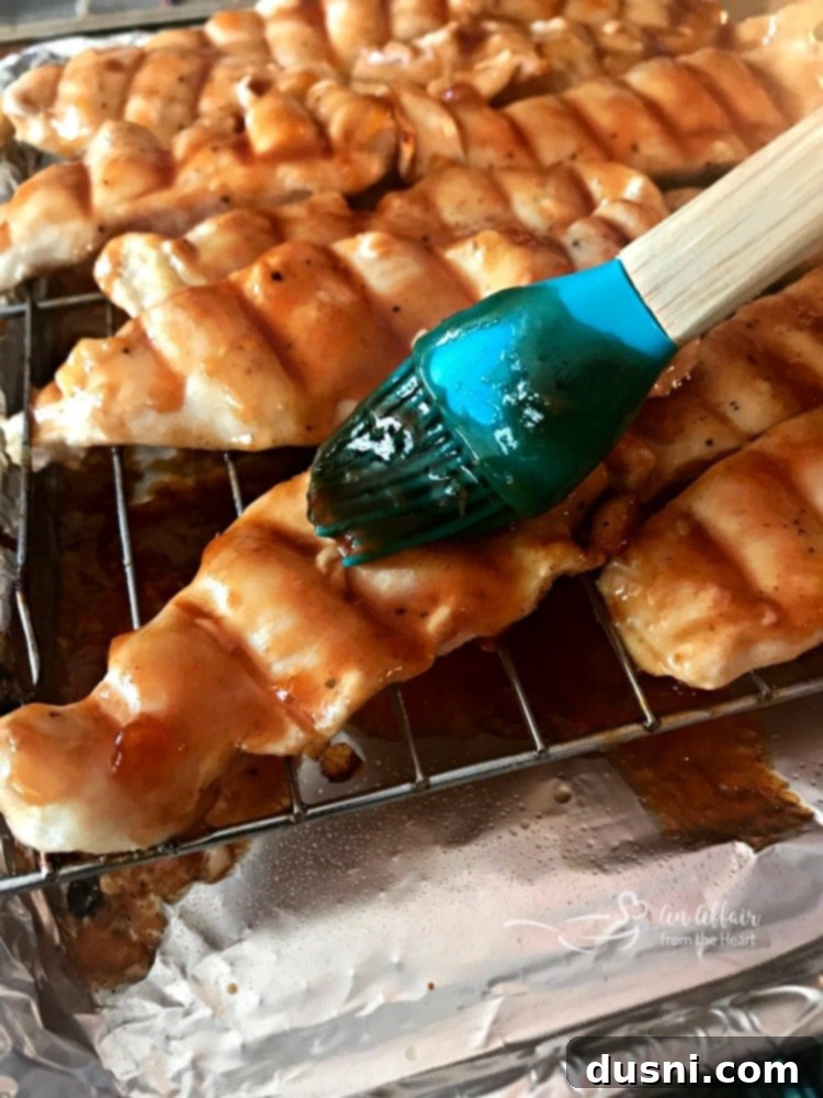 Sweet & Smoky Apricot BBQ Chicken 8 Brushing the apricot BBQ glaze onto the chicken during baking
