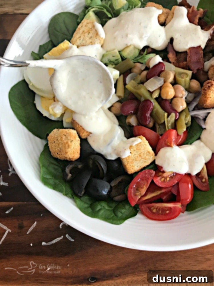 Loaded Spinach Salad with Creamy Roasted Garlic Dressing - a hearty and healthy meal option