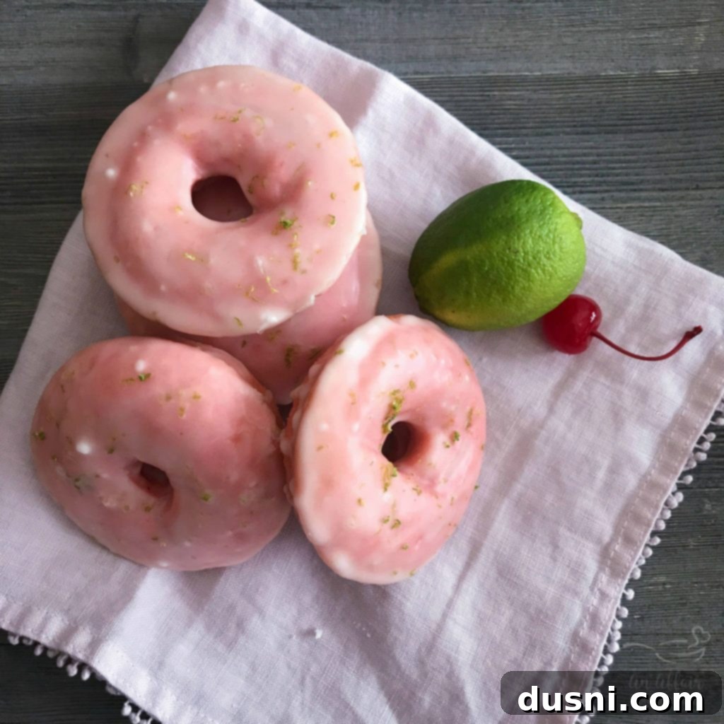 Cherry Limeade Baked Donuts with a fluffy pink cake texture and tart lime glaze