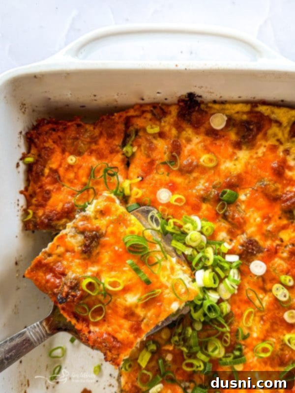 Whole baked sausage crescent breakfast casserole on a cutting board