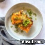 Overhead of Slices of Sausage Crescent Breakfast Bake on a white plate