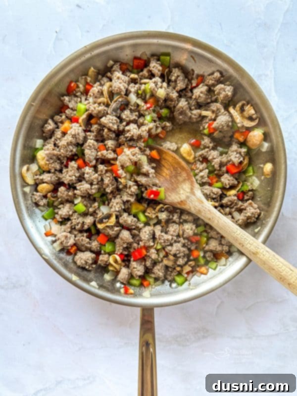 Cooked sausage and vegetable mixture