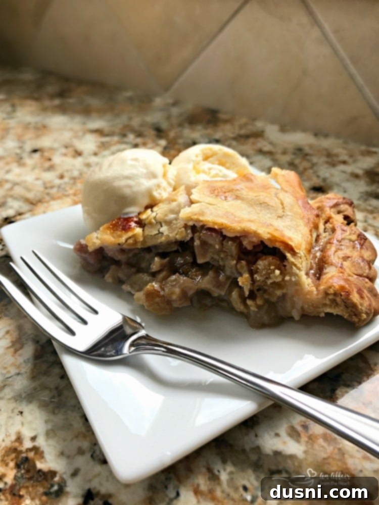 Grandma's Rhubarb Pie on a white plate with a fork
