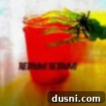 Side view of redrum punch in a glass with a fake skeleton hand on it. Text "redrum! redrum!"