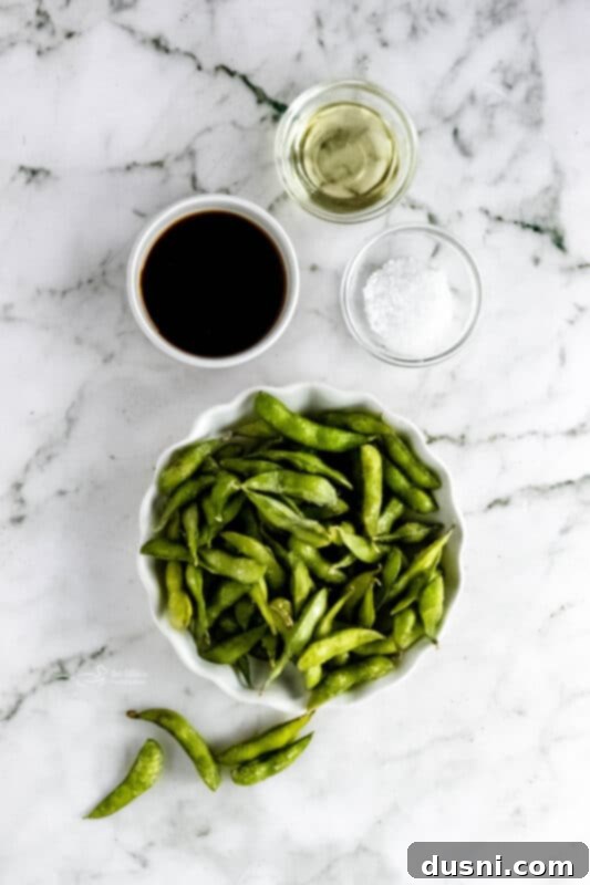 Air fryer edamame beans served in a small white bowl
