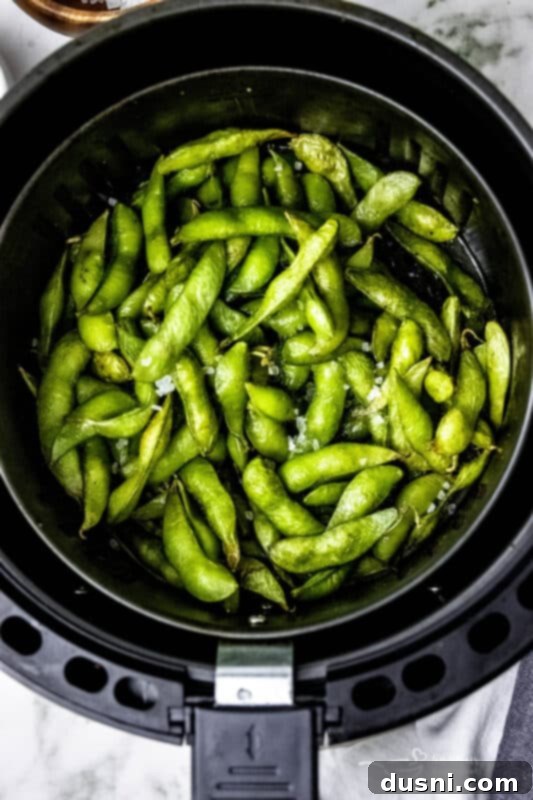A bowl of air-fried edamame beans, ready to eat