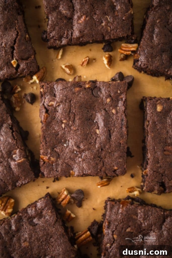 A festive image of a pan of pecan brownies, ready to be pinned on Pinterest.