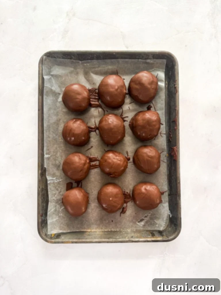 Dipping No-Bake Butterfinger Cookies in Chocolate