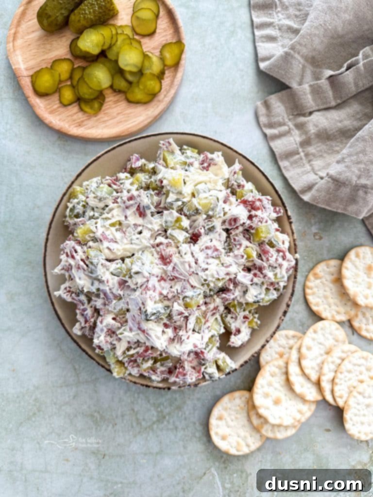 Dill Pickle Dip in a bowl surrounded by crackers
