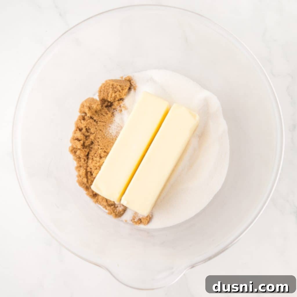 Mixing butter and sugar in a bowl